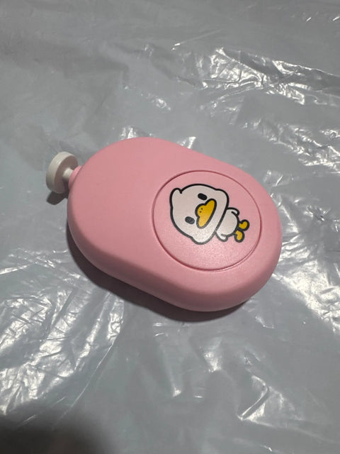 Buyer photo of the trimmer and its filing pads unpacked