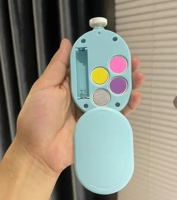 The trimmer opened in one hand, showing the storage compartment and filing pads