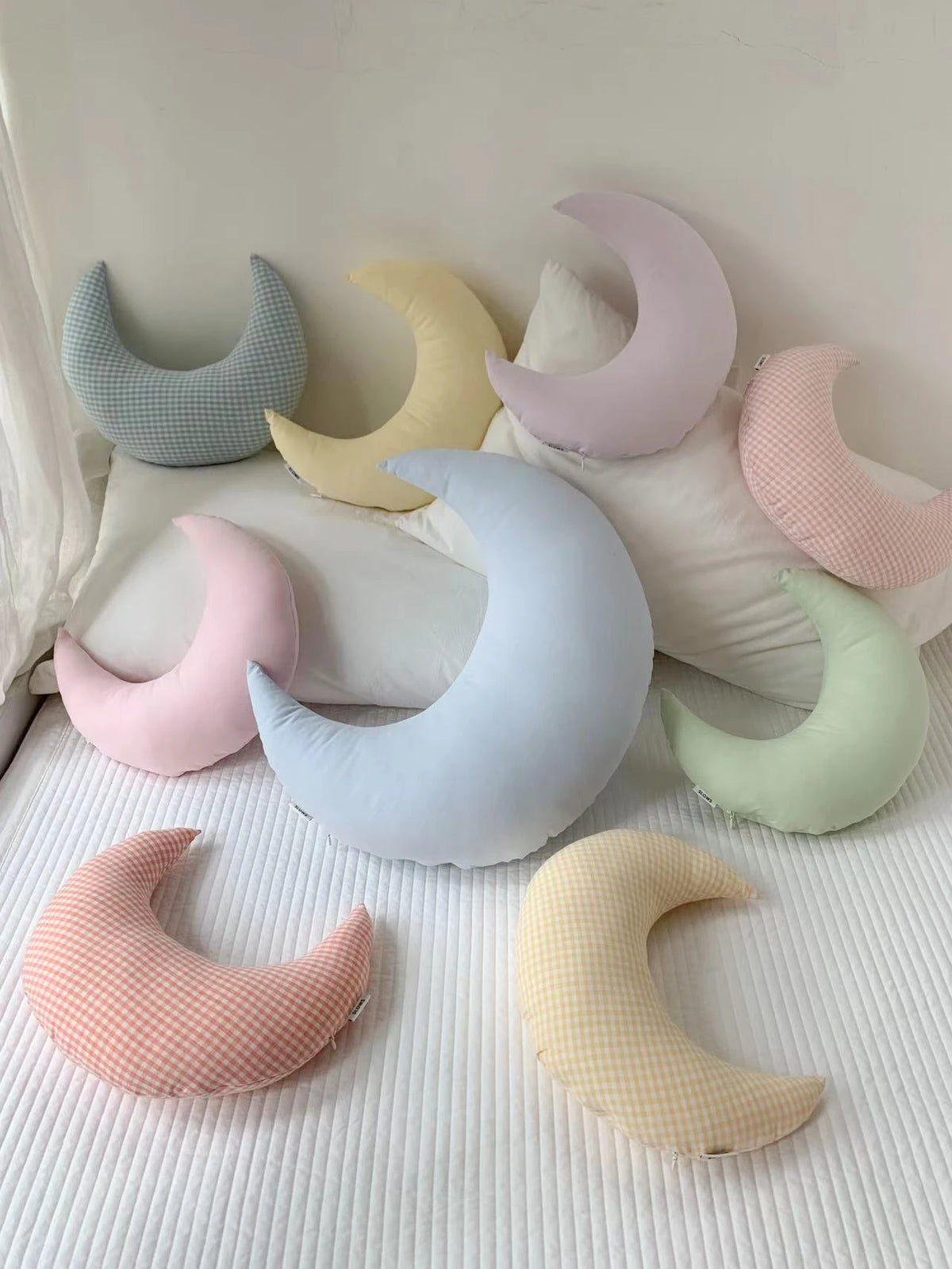Moon cushion styled in a cosy reading corner