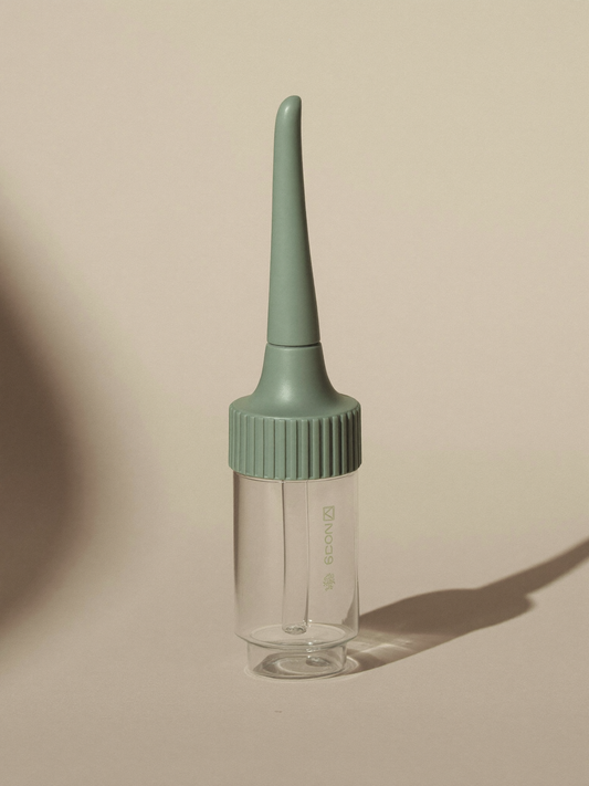 PLACEHOLDER (AI-generated) - Silicone nasal aspirator on cream
