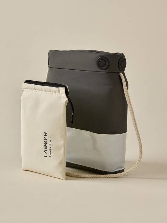PLACEHOLDER (AI-generated) - Folded travel blackout blind with pouch on cream