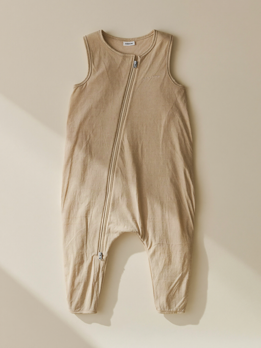 PLACEHOLDER (AI-generated) - Cream baby sleep bag laid flat on cream