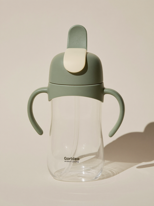 PLACEHOLDER (AI-generated) - Cream and sage toddler straw cup on cream